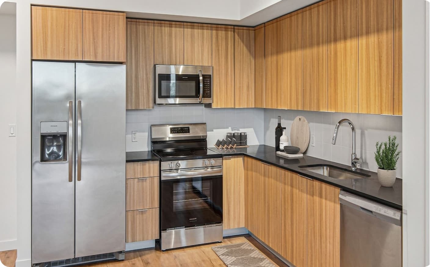 Wood kitchen cabinets with stainless steel appliances